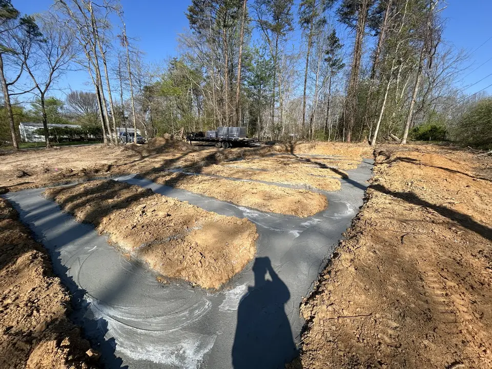 In progress photo 1: Lot clearing and footings for a new home