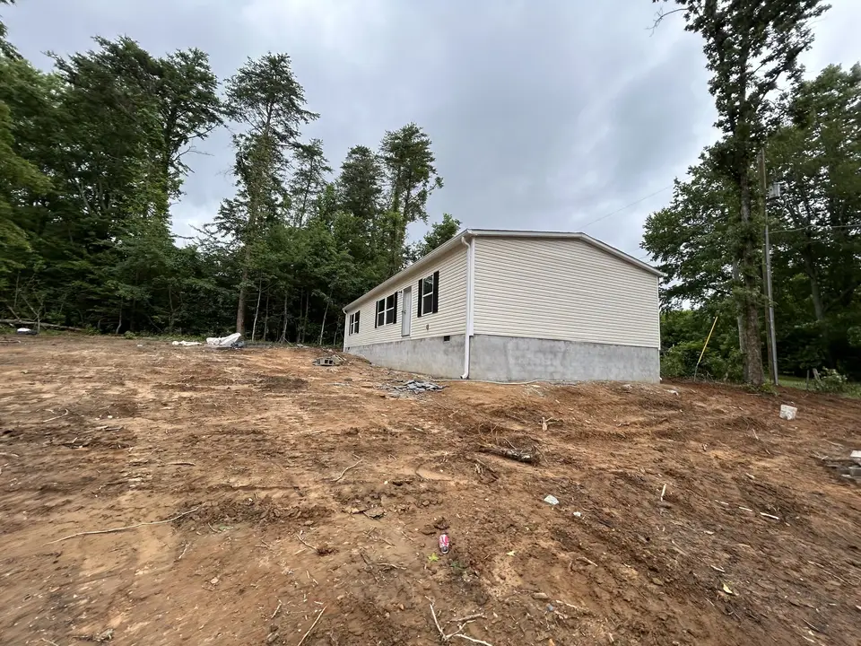 Before photo 2: Final grading and gravel drive for a new home