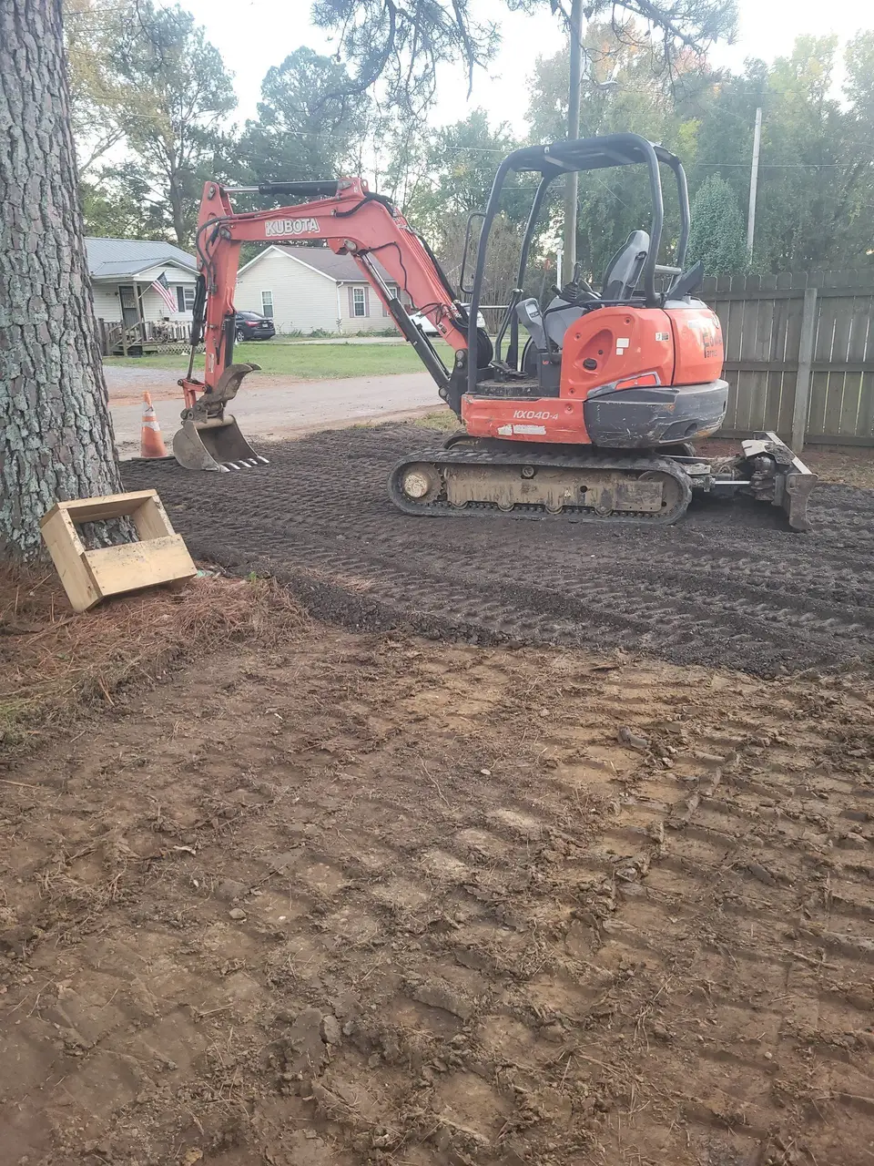 Mini excavator on a freshly graded lot